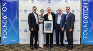 Image of award recipient Dr. Bruce Powell with Marvin I. Schotland, Foundation President Rabbi Aaron Lerner, Foundation Trustee Daniella Naim Kahen, and Board President Evan Schlessinger. Bruce Powell is holding the award.